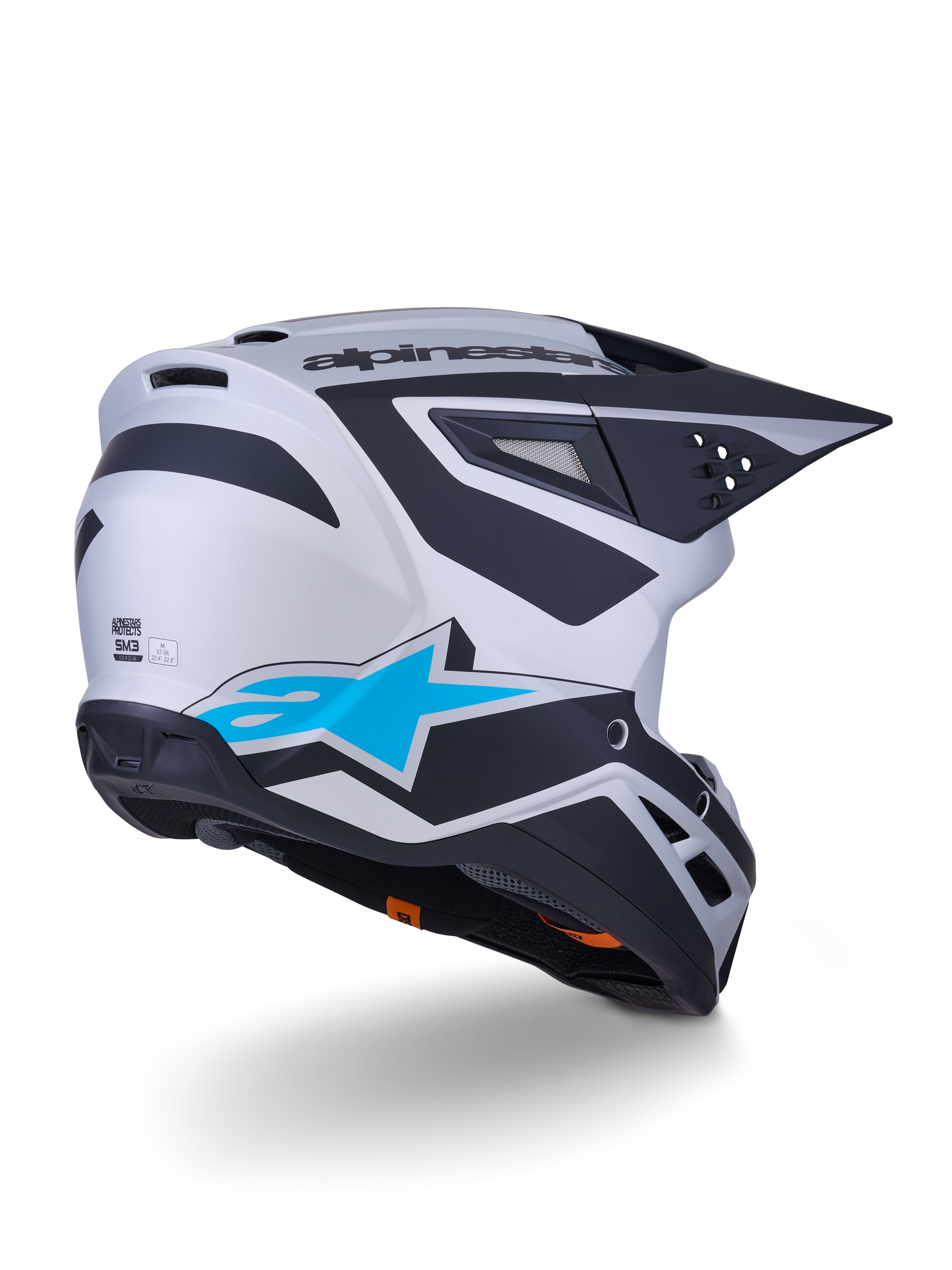 Alpinestars S-M3 Heat Helm ECE 22.06, Motocross-Helm, Silber-Blau und Schwarz Matt, Rückansicht mit großem blauen Stern-Logo und schwarzen kantigen Designs, aerodynamische Schale mit Belüftungsöffnungen, Hochleistungs-Schutz für Offroad-Rennen