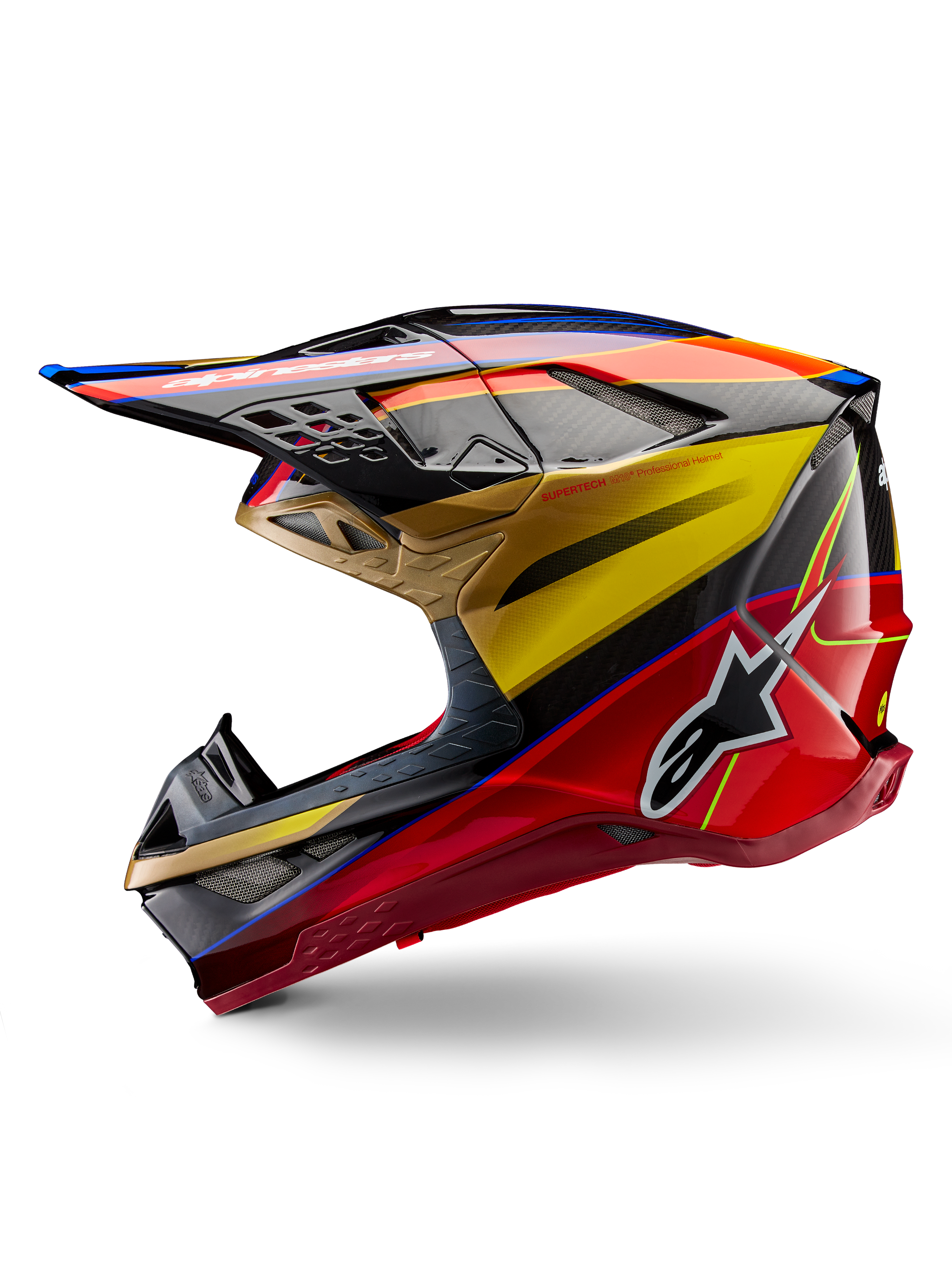 Alpinestars Supertech M10 Era Helm, Motocross-Helm, Goldgelb und Rio-Rot Glänzend, Seitenprofil mit Carbonfaser-Textur und markanten Grafiken, Alpinestars-Stern-Logo, aerodynamische Form mit mehreren Belüftungsöffnungen, professioneller Schutz für den Offroad-Rennsport