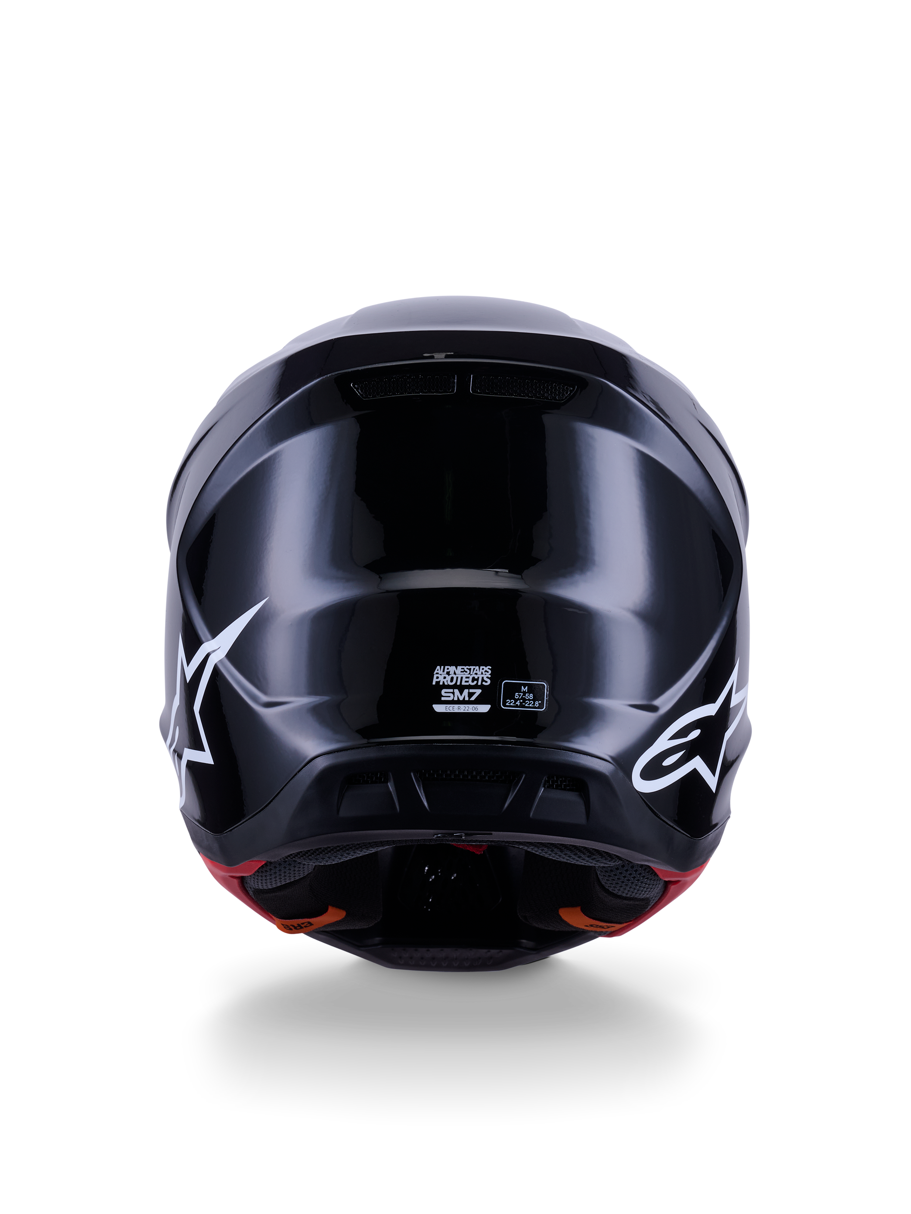 Alpinestars S-M7 Solid Helmet ECE 22.06, Motocross Helmet, Glossy Black, rear view featuring white star logos, aerodynamic composite shell with a high-shine finish, safety certification and size labels in the center