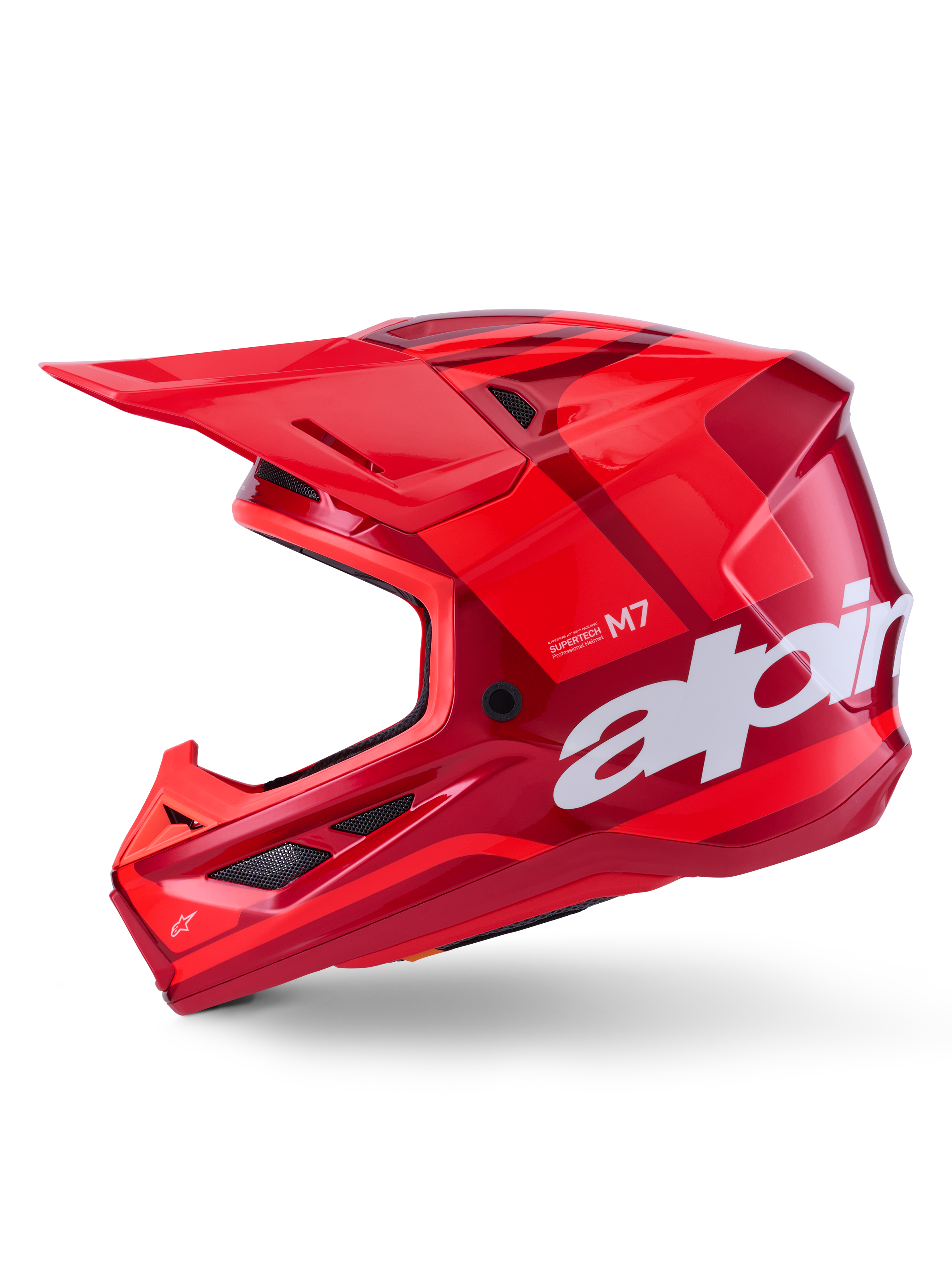 Alpinestars S-M7 Core Helm, Rot glänzend mit geometrischen Akzenten, Motocross-Helm, Seitenansicht, aerodynamische Schale mit Belüftungsöffnungen und weißem Branding, Hochleistungs-Offroad-Rennausrüstung