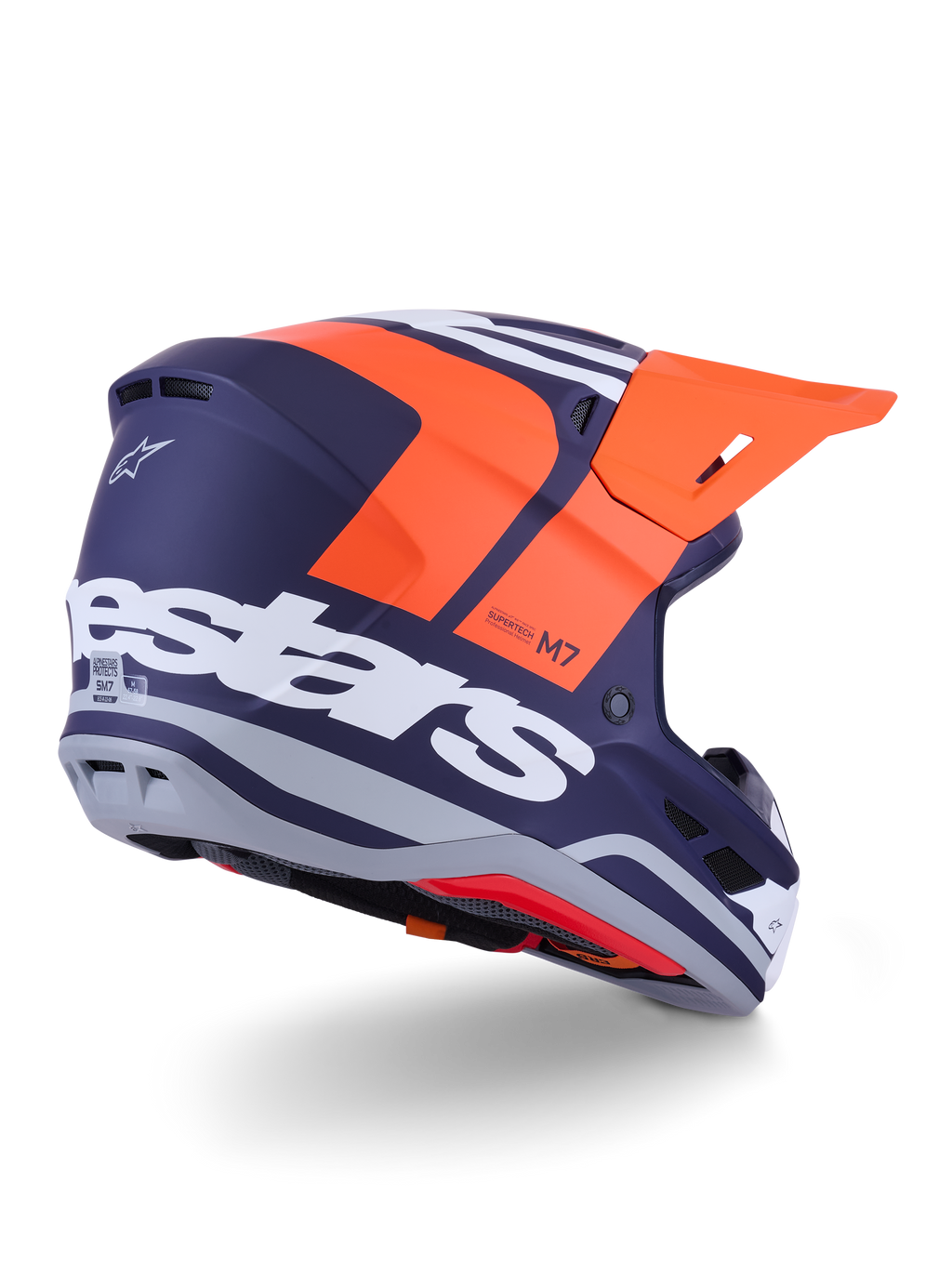 Alpinestars S-M7 Core Helm, Motocross-Helm, Orange und Blau Matt, Rückansicht mit markantem weißem Alpinestars-Branding auf der Rückseite, leuchtend oranges Visier, aerodynamische Verbundschale mit grauen Akzenten, professioneller Schutz für Offroad-Rennsport