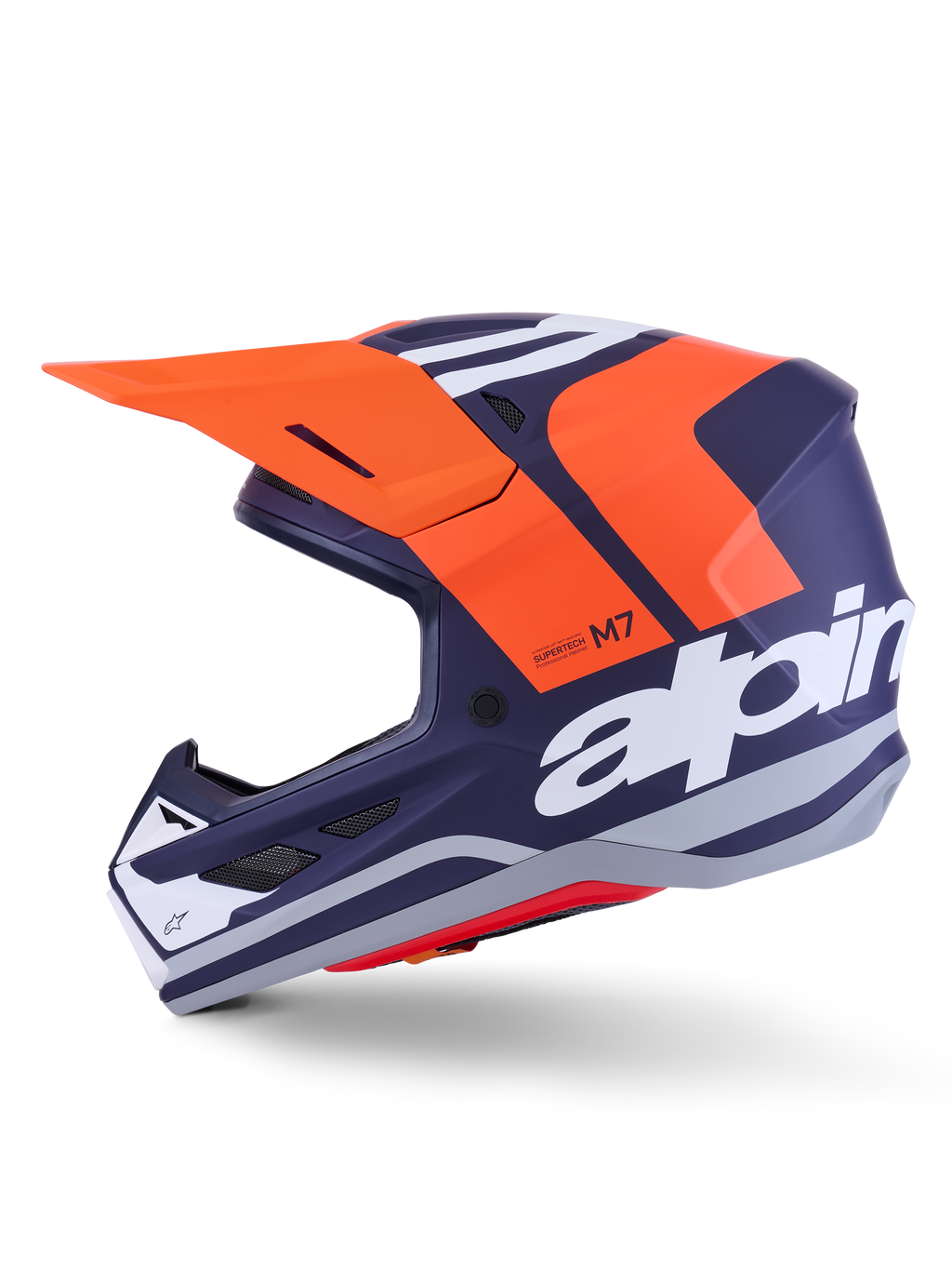 Alpinestars S-M7 Core Helm ECE 22.06, Seitenprofil, mattes Finish in Navyblau und Orange, großes weißes Branding an der Seite, aerodynamischer Motocross-Helm mit Schutzvisier