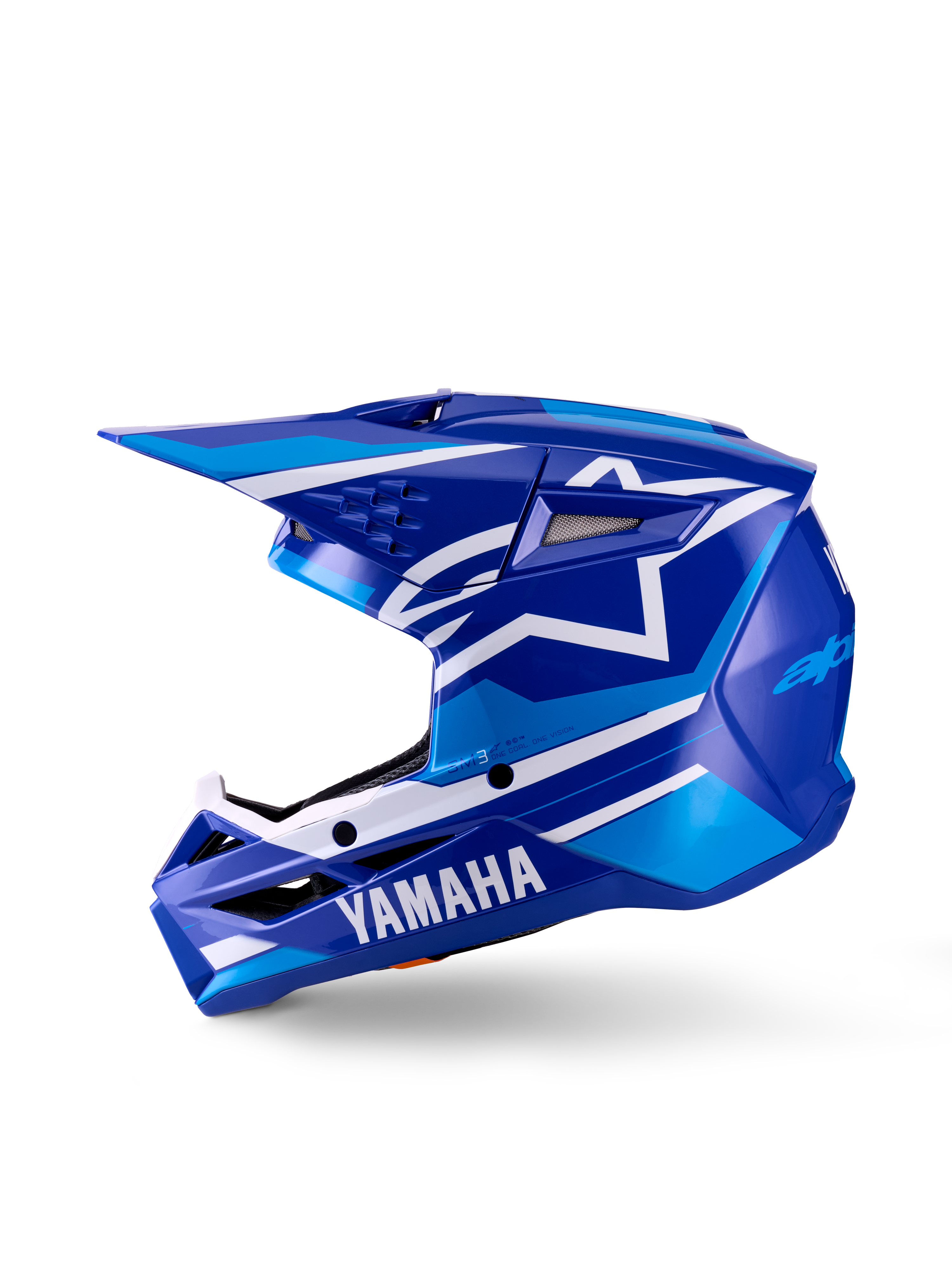 Yamaha S-M3 Jugend-Motocross-Helm, Motocross-Helm, Blau Weiß Glänzend, Seitenprofil-Ansicht, mit markantem Yamaha-Branding am Kinnschutz und Alpinestars-Stern-Logo, schlanke aerodynamische Schale mit mehreren Belüftungsöffnungen und integriertem Visier.