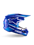 Yamaha S-M3 Jugend-Motocross-Helm, Blau-Weiß glänzend, Seitenansicht mit markantem Yamaha-Branding und Alpinestars-Sternlogo, geometrisches Design mit hellblauen Akzenten, belüftete Schale mit langem Visier, ECE 22.06 zertifizierter Offroad-Kopfschutz