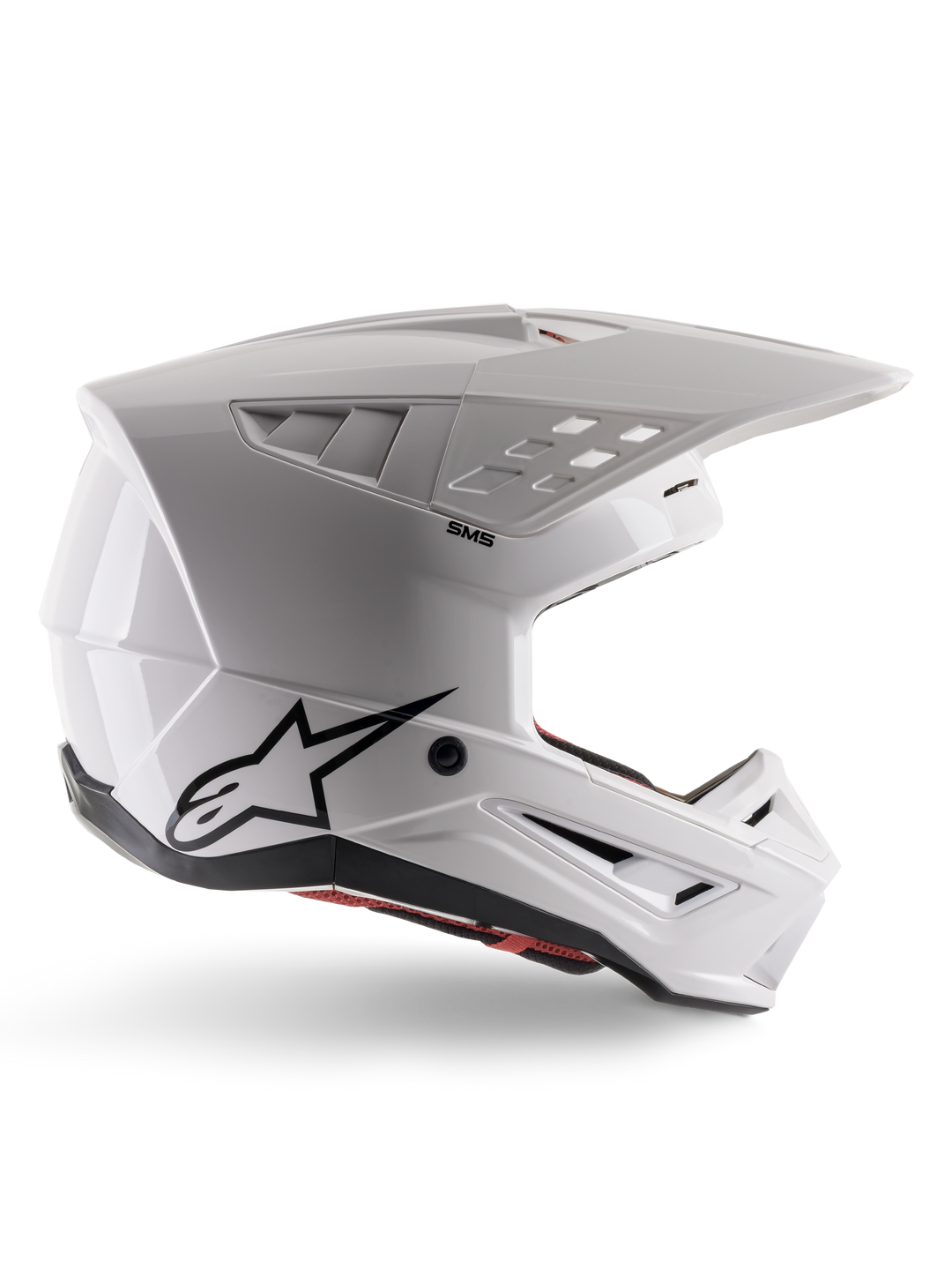 Alpinestars S-M5 Solid Helm ECE 22.06, Motocross-Helm, Weiß glänzend, Seitenprofil mit eckigem aerodynamischem Design, markanter Helmschild, integrierte Belüftungsöffnungen, schwarzes Astars-Logo auf der Rückseite und sichtbare rote Innenpolsterung