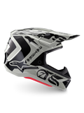Alpinestars Limited Edition S-M7 Wolf Dust Helm, Motocross-Helm in Dune Black Glossy, Seitenprofil mit markanten schwarzen Grafiken und Branding, roten Akzenten an der Unterseite, aerodynamischer Offroad-Kopfschutz