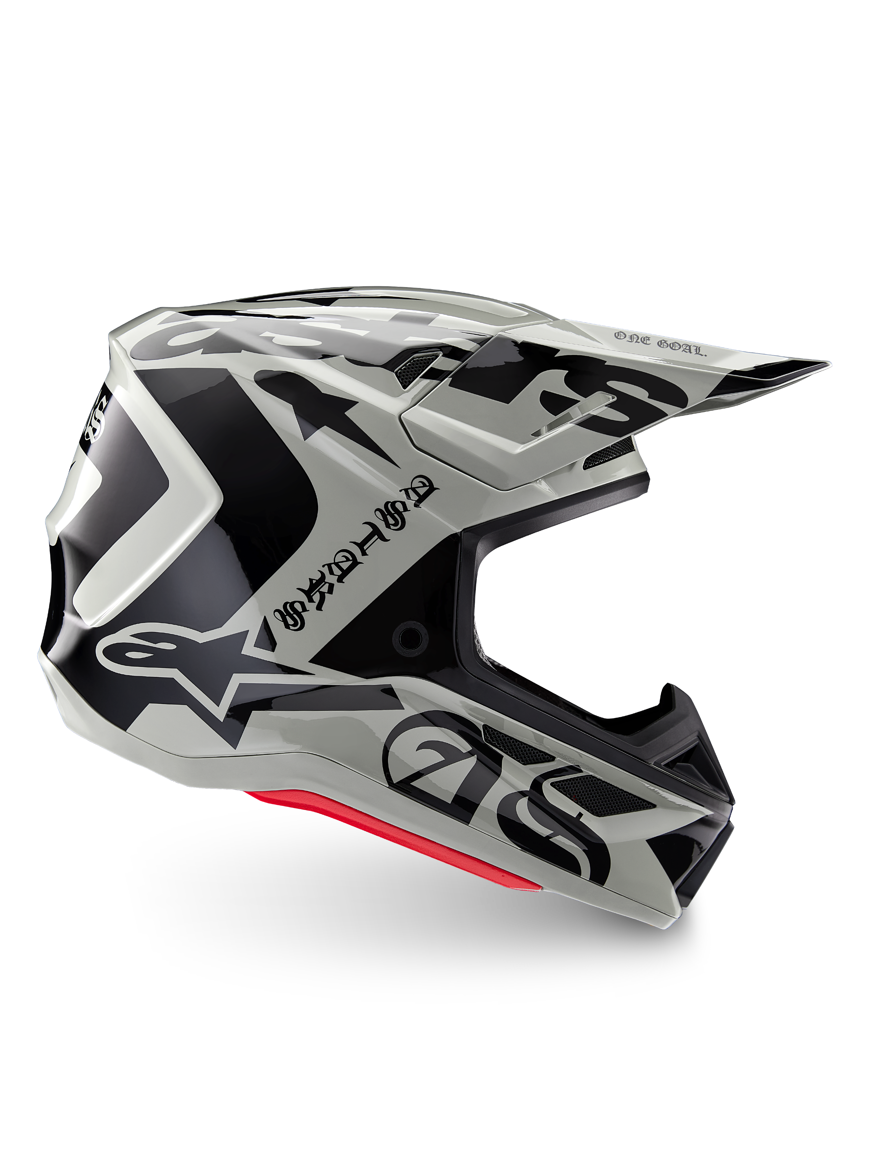Alpinestars Limited Edition S-M7 Wolf Dust Helm, Motocross-Helm in Dune Black Glossy, Seitenprofil mit markanten schwarzen Grafiken und Branding, roten Akzenten an der Unterseite, aerodynamischer Offroad-Kopfschutz