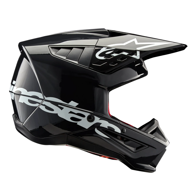 Alpinestars S-M5 Corp Helmet, Motocross Helmet, Dark Gray Glossy, side profile view with large white Alpinestars logo, white star logo on the visor, sleek aerodynamic vents, glossy finish, off-road racing protection