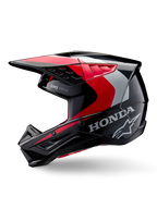 Alpinestars Honda S-M5 Helm, Motocross-Helm, Schwarz, Rot und Silber glänzend, Seitenansicht mit Honda-Branding und Alpinestars Stern-Logo, schlankes Design mit integriertem Helmschirm und Belüftungsöffnungen für Offroad-Performance