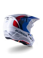Alpinestars Honda S-M5 ECE Helm, Motocross-Helm, Weiß, Blau und Rot Glänzend, mit markantem Honda-Branding und Alpinestars-Logos, aerodynamische Schale mit integrierten Belüftungsöffnungen und verstellbarem Visier, Schutzausrüstung für den Offroad-Rennsport