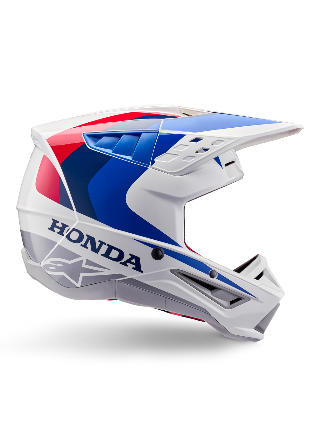Alpinestars Honda S-M5 Helm ECE, Motocross-Helm, Weiß, Blau und Rot, Seitenprofil-Ansicht, aerodynamisches Design mit integriertem Visier, mehrere Belüftungsöffnungen, glänzendes Finish, markantes Honda-Branding und Alpinestars-Logo