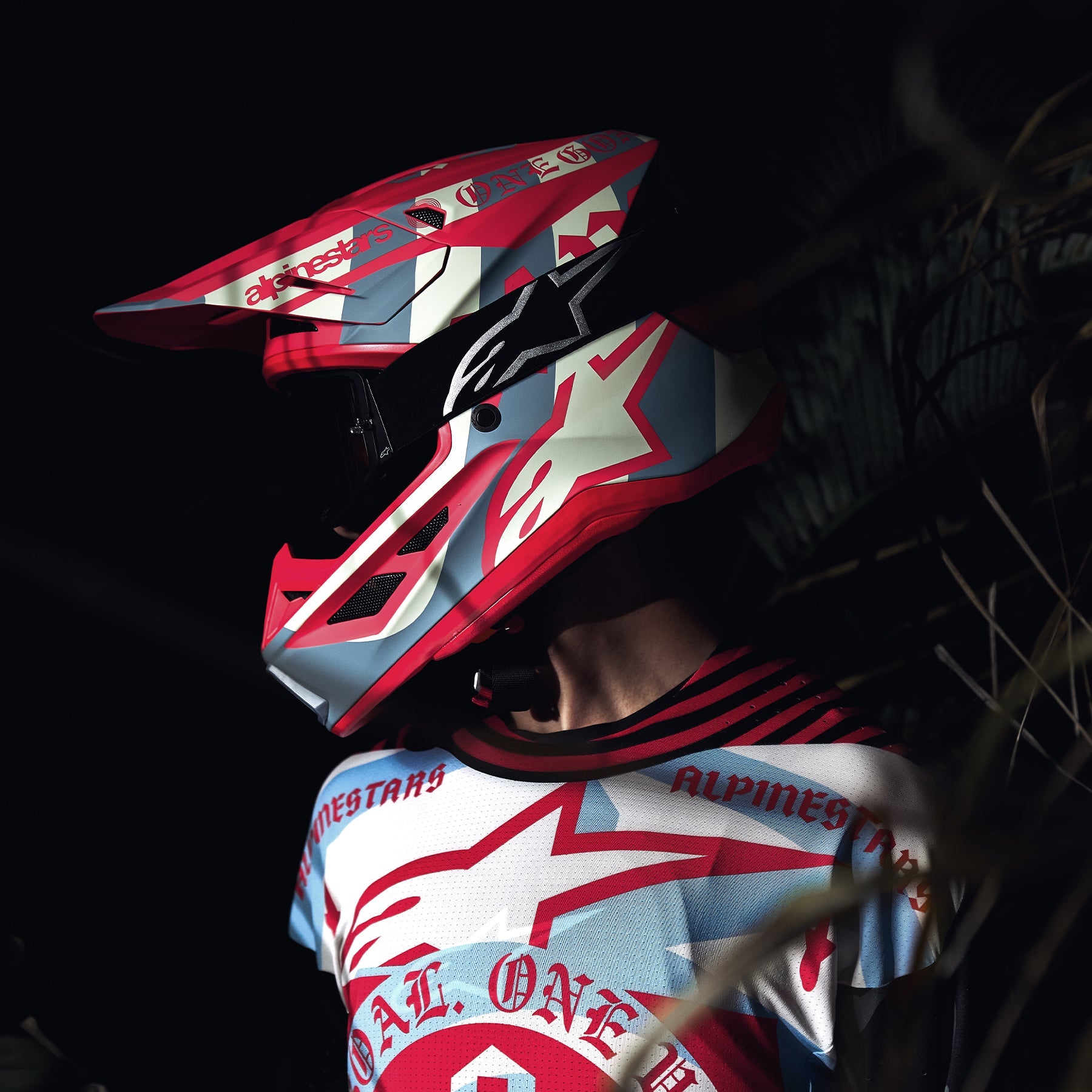 Alpinestars S-M7 Beast Coast Helmet, motocross racing helmet, orange and gray, worn by rider in matching jersey.