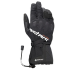 Alpinestars XT-5 GORE-TEX Handschuhe, schwarze Motorradhandschuhe mit weißem Astars-Branding und orangefarbenem ADV-TECH-Schriftzug, langes Stulpendesign mit verdecktem Knöchelschutz, GORE-TEX Logo und Kordelzugverschluss, Adventure-Touring-Ausrüstung