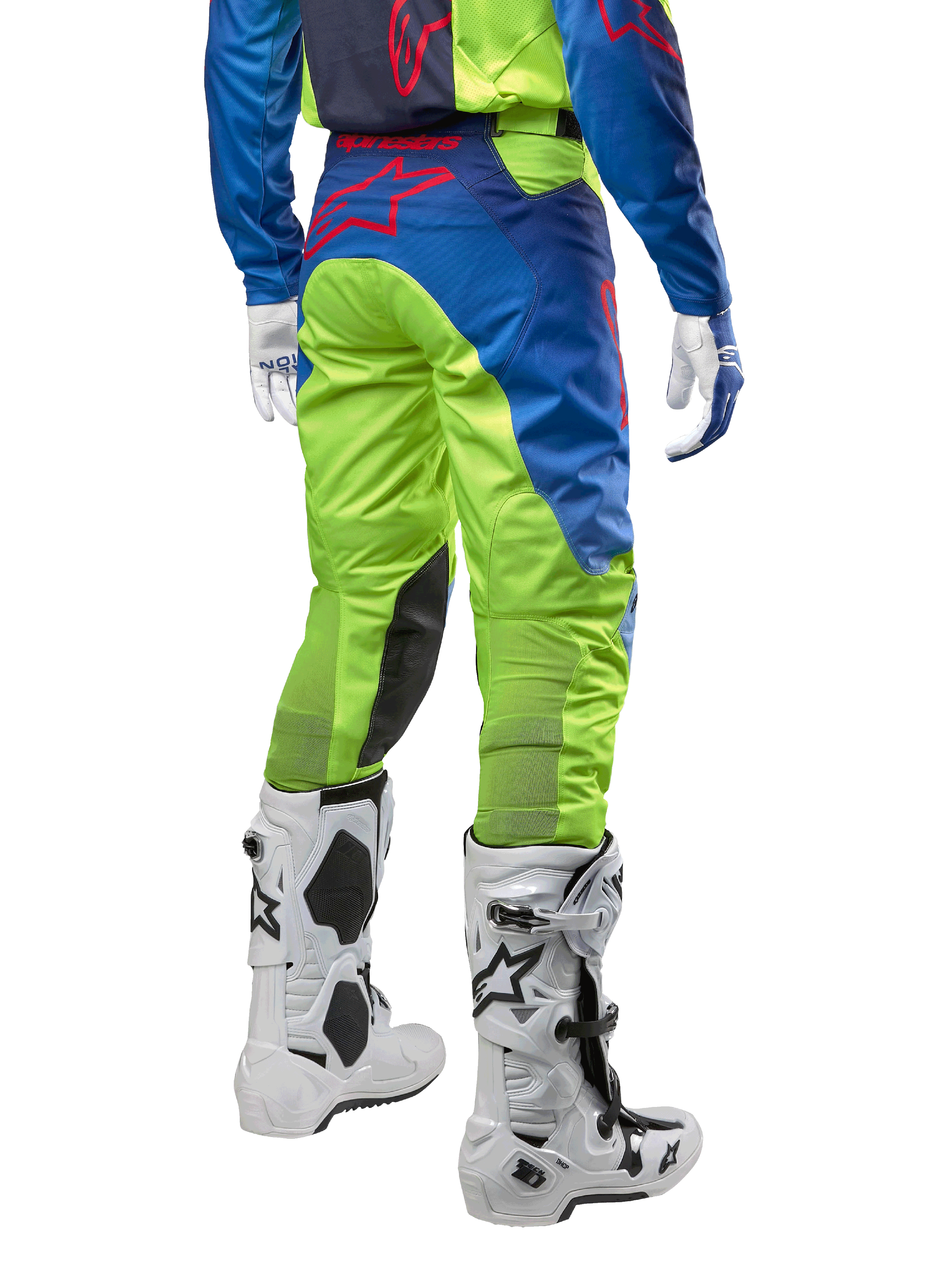 Alpinestars 2024 Racer Hoen Hose, Motocross-Hose, Gelb Fluo und Blau Night Navy, Rückansicht, mit rotem Alpinestars-Logo, getragen mit passendem Jersey, weißen Handschuhen und weißen Motocross-Stiefeln, strapazierfähiges Textil für Offroad-Rennsport