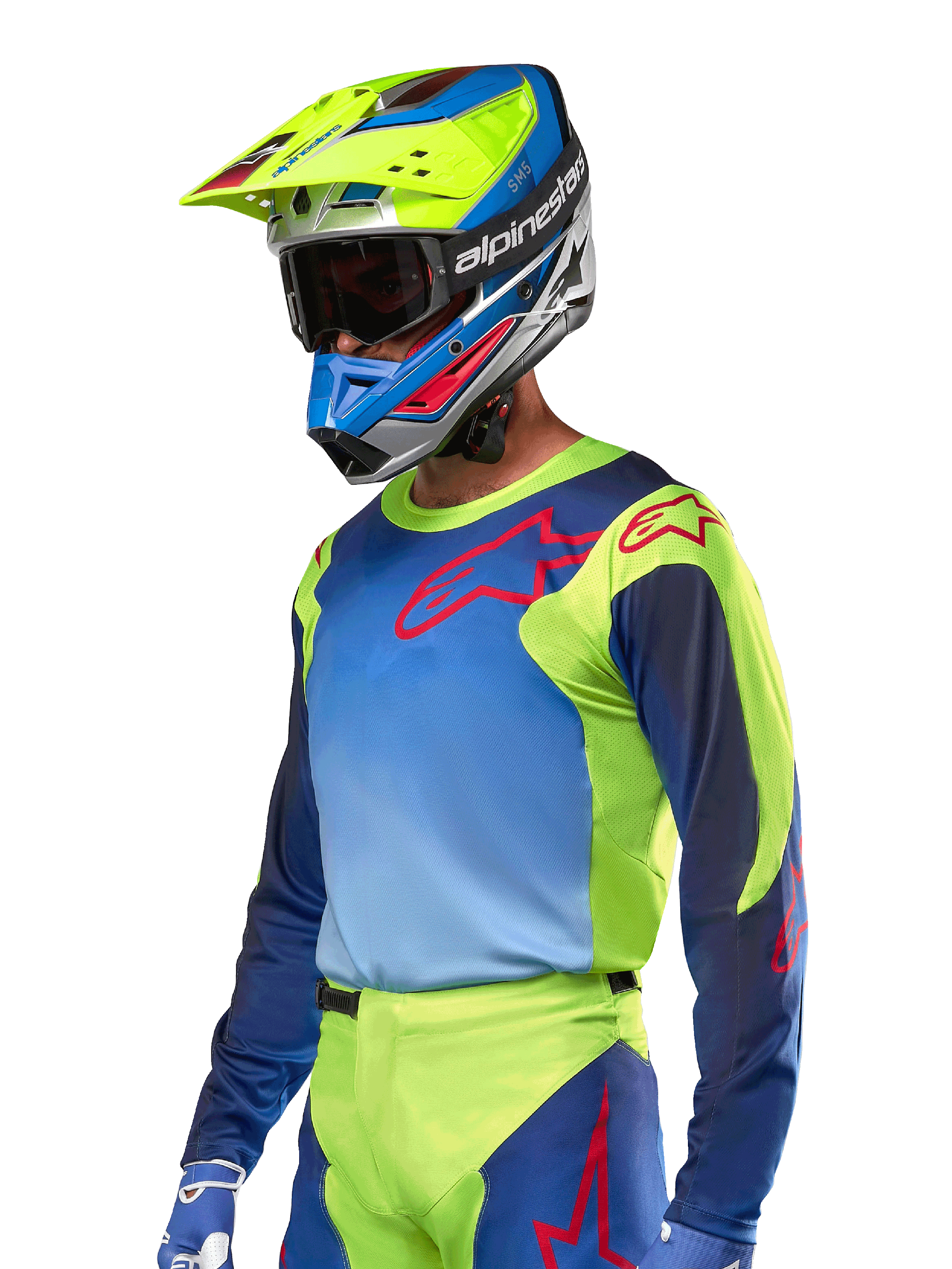 Alpinestars 2024 Racer Hoen Jersey, Motocross Jersey, Yellow Fluo and Blue Night Navy with red logos, worn with a matching yellow, blue, and red helmet and blue gloves, vibrant gear for off-road racing