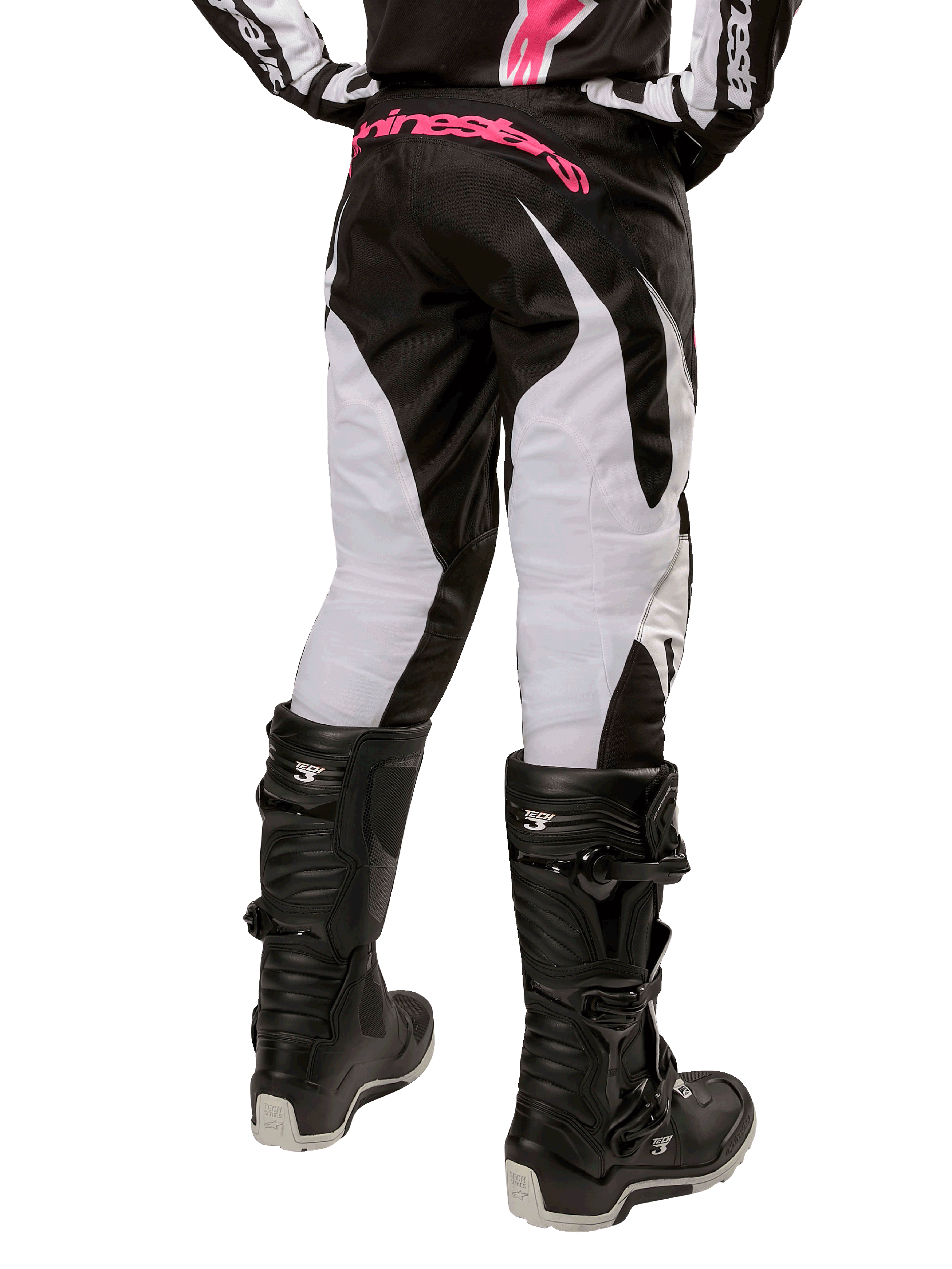 Alpinestars Damen-Stella 2024 Fluid Hose, Motocross-Hose, Schwarz und Weiß, Rückansicht mit weißen Beinbahnen und pinkem Branding am Hosenbund, kombiniert mit schwarzen Tech 3 Stiefeln, strapazierfähige Ausrüstung für den Offroad-Rennsport