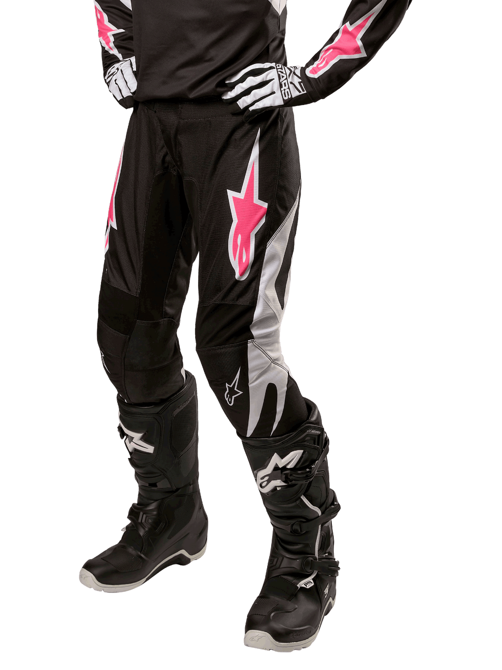 Alpinestars Stella Fluid Damen-Hose 2024, Motocross-Hose, Schwarz und Weiß mit pinken Akzenten, getragen mit passender Schutzausrüstung einschließlich Stiefeln und Handschuhen, strapazierfähiges, flexibles Material für den Offroad-Einsatz