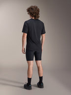 Alpinestars A-Dura Liner Shorts, Black Cycling Liner Shorts, back view on model, tight-fitting stretch fabric with visible chamois padding seams, paired with a black t-shirt and cycling shoes, mountain bike apparel