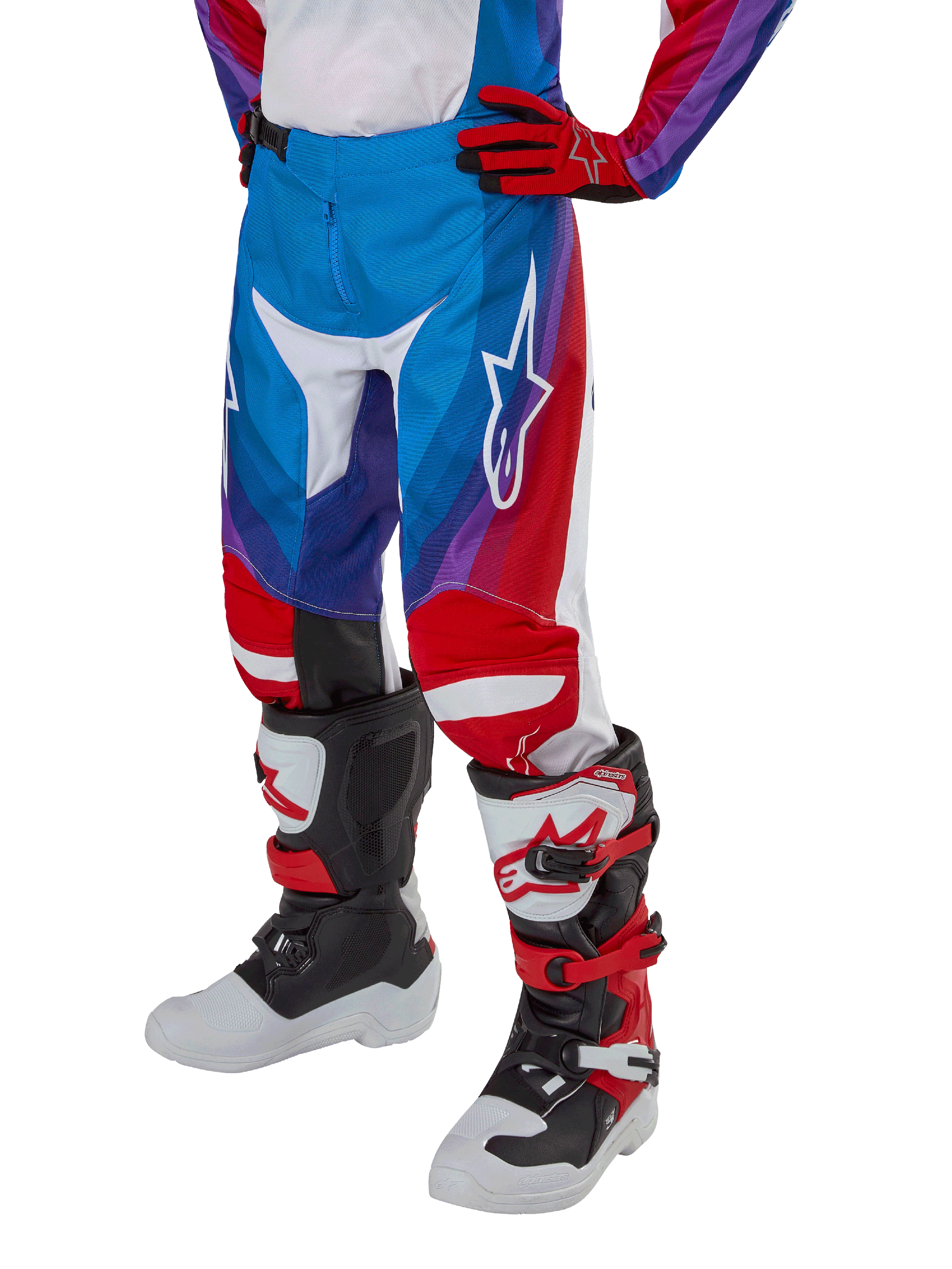 Alpinestars Youth 2024 Racer Pneuma Pants, Motocross Pants, Blue Red and White, worn with matching gloves and boots, featuring a white star logo on the thigh, sporty design for off-road riding