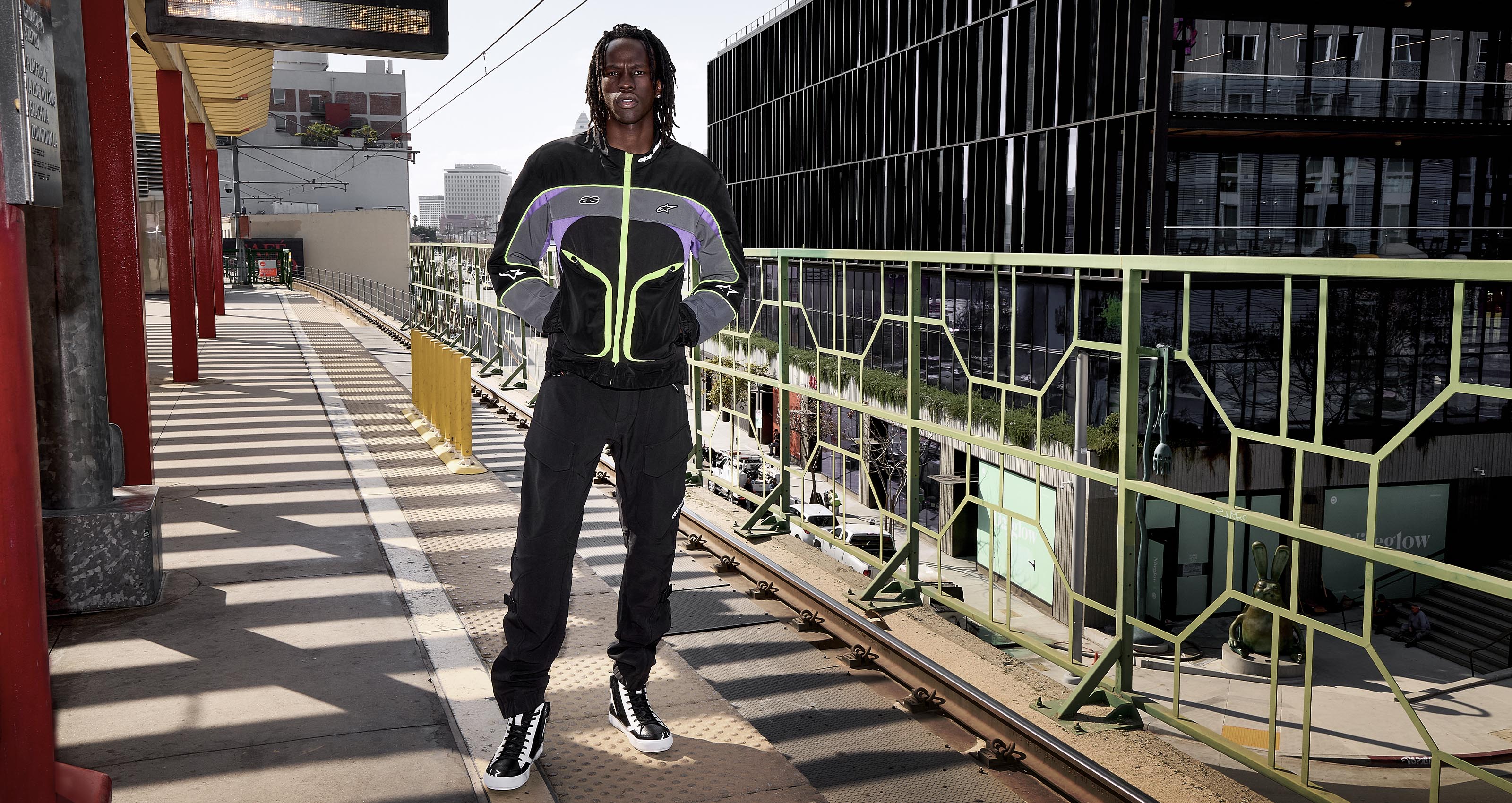 Alpinestars Juggernaut V2 Riding Pants, Men's Black Urban Motorcycle Pants, softshell ripstop fabric on a city platform.