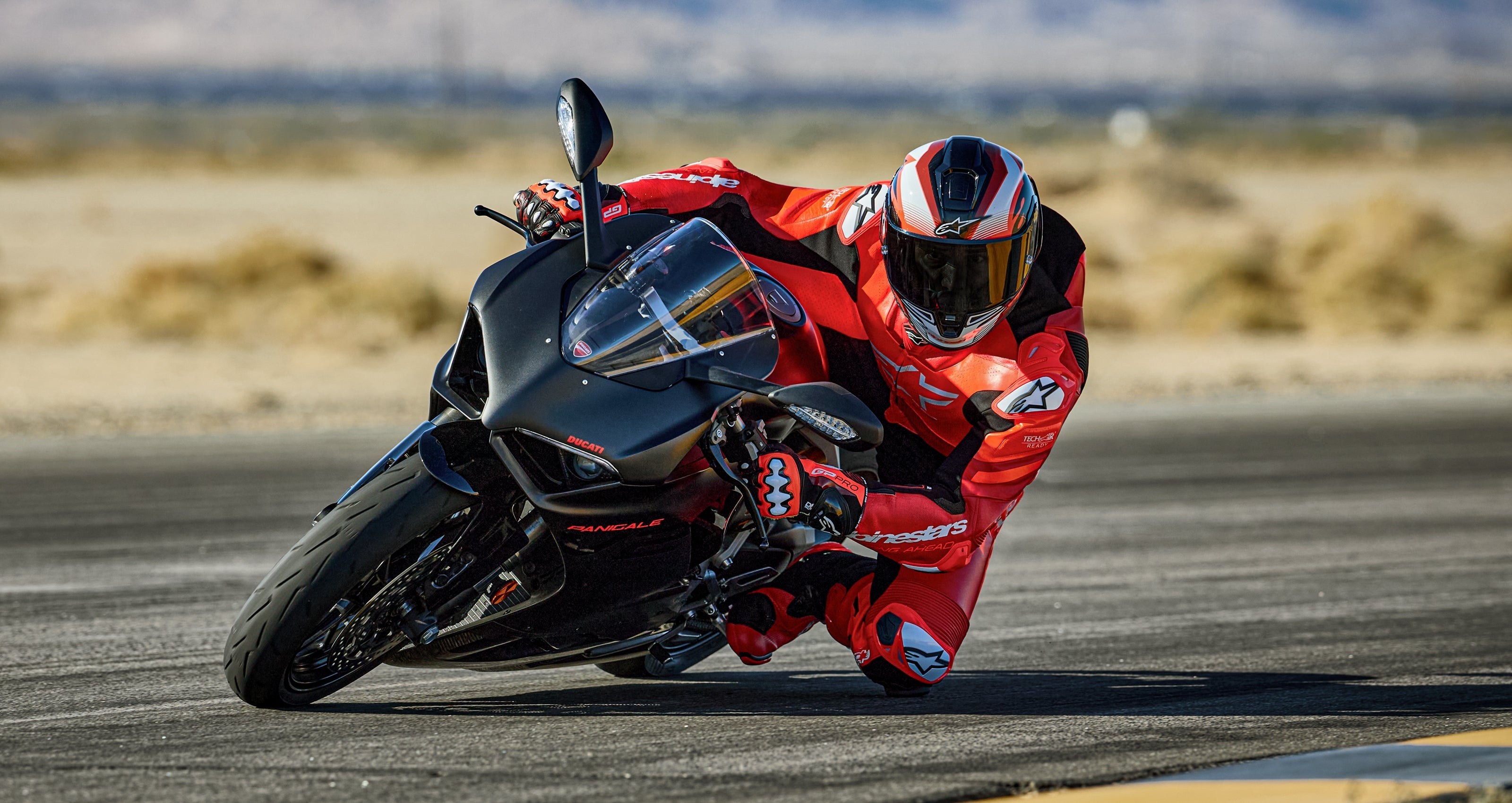 Alpinestars GP Plus V4 Sprint Leather Suit, red and black one-piece racing suit, premium leather for track performance.